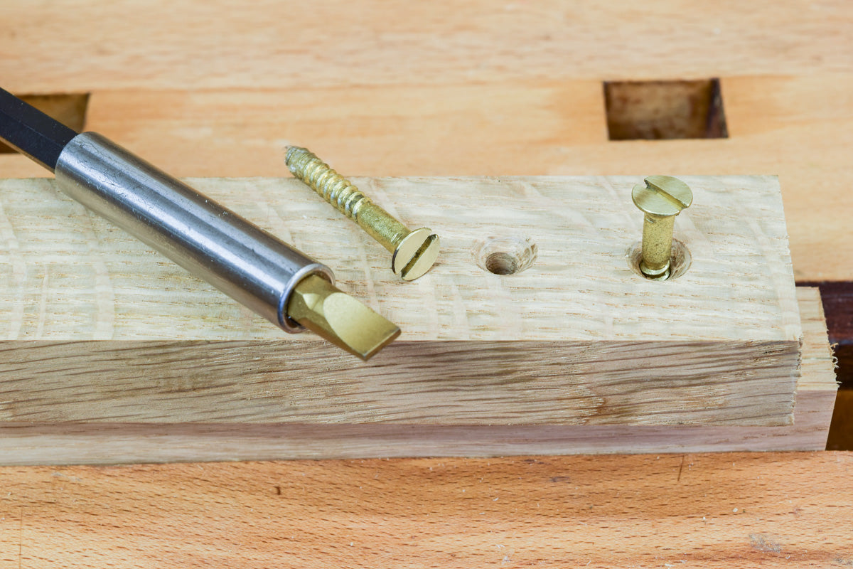 Driving brass countersunk screws using a slotted screwdriver bit