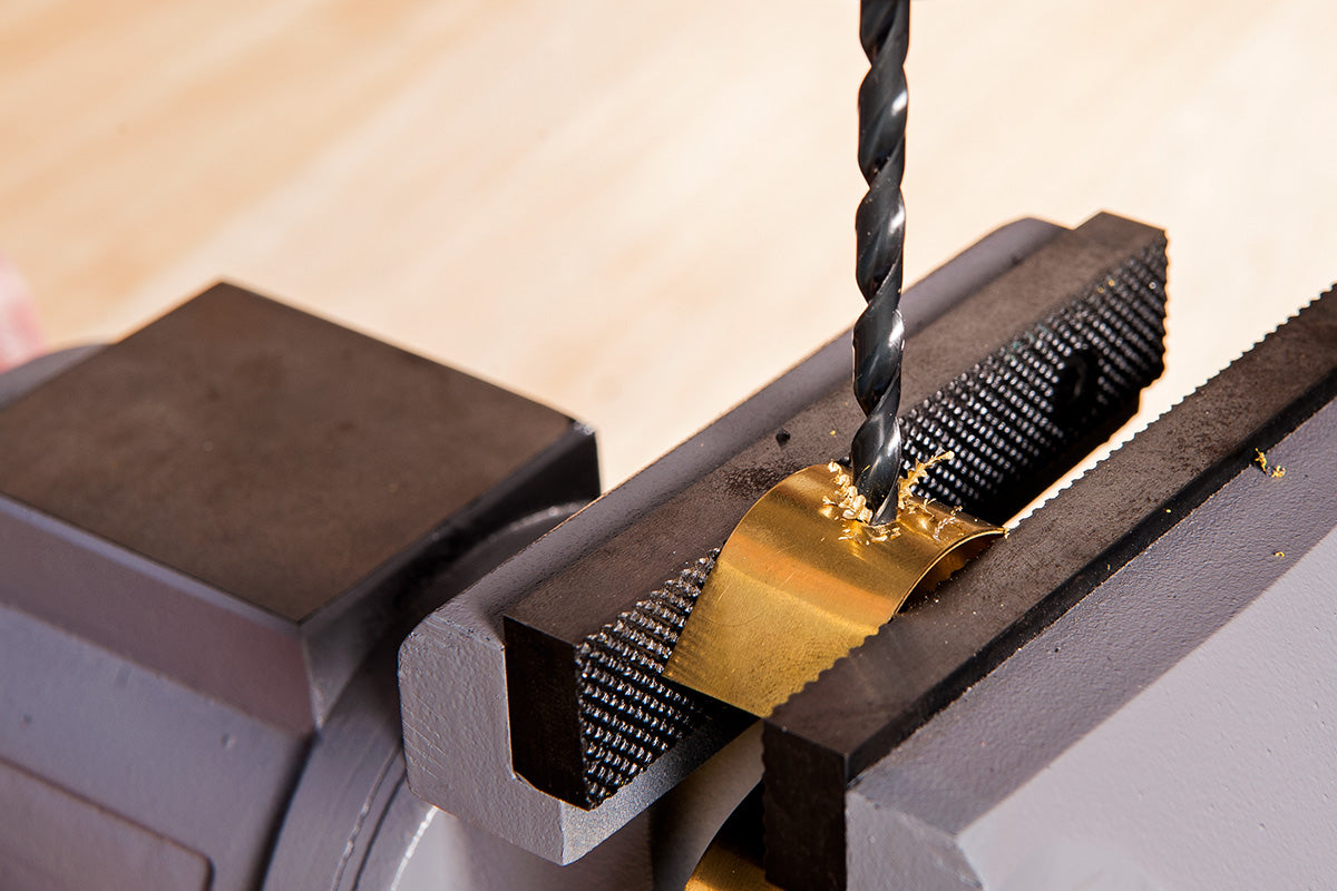 Drilling through metal