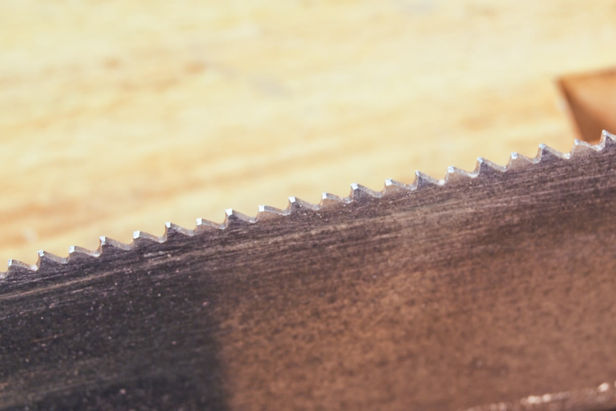 The flatter point of saw sharpening