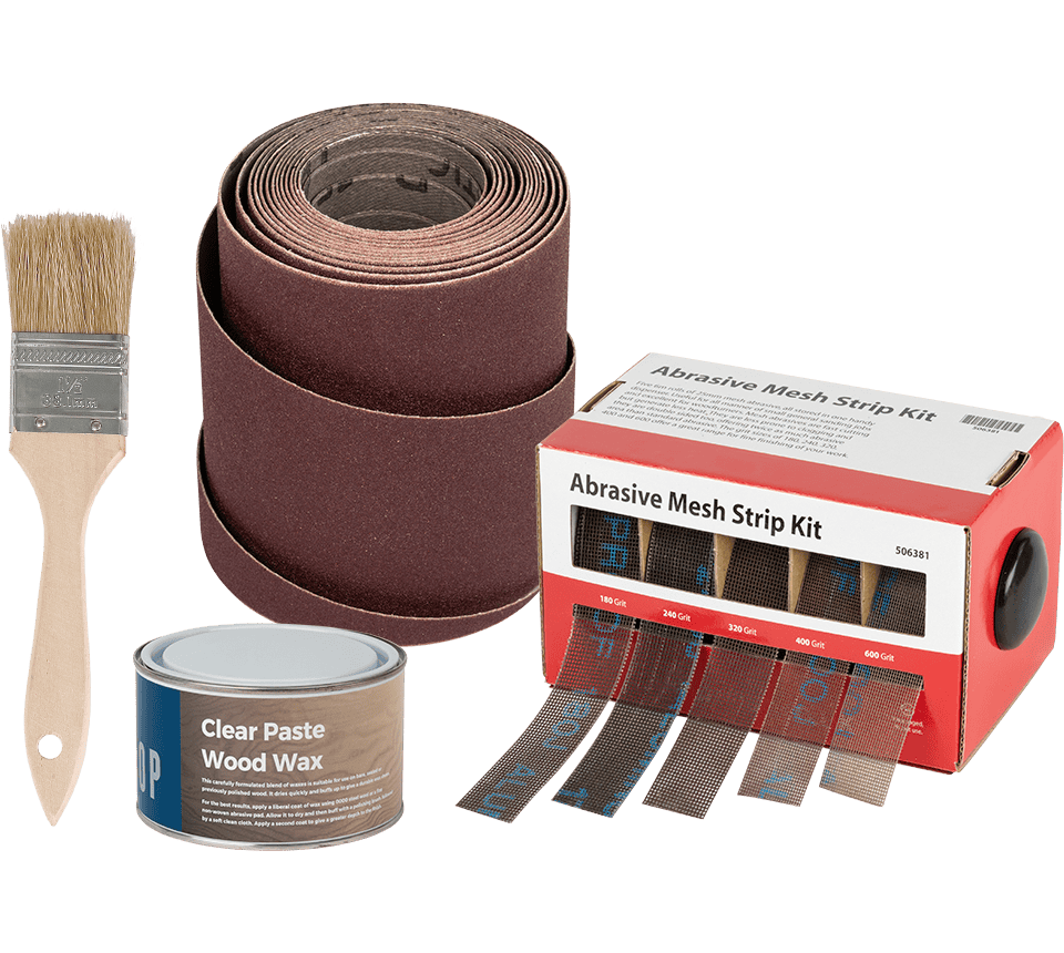 Abrasive mesh strip kit with a roll of brown sanding belts, a box labeled Abrasive Mesh Strip Kit, clear paste wood wax in a can, and a paintbrush on a white background.