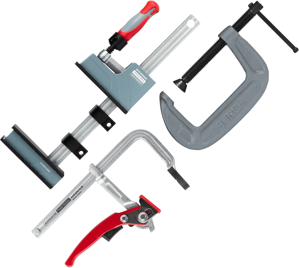 A set of four different types of hand clamps arranged diagonally on a solid white background, including a 3-inch C-clamp, a square clamp, a toggle clamp, and a quick-release clamp.