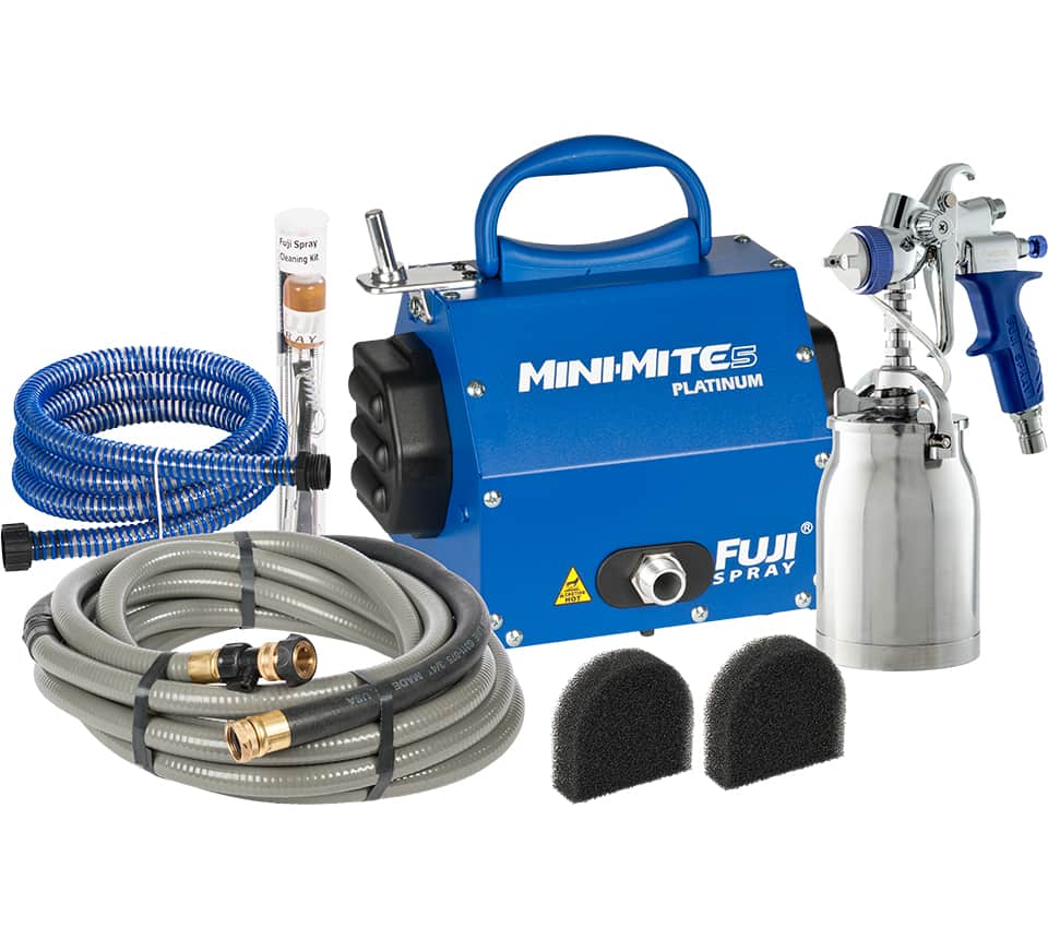 A Fuji Mini-Mite Platinum paint spray kit with a blue portable air compressor, a silver spray gun, a blue hose, a grey hose, two black foam sponges on a white background.