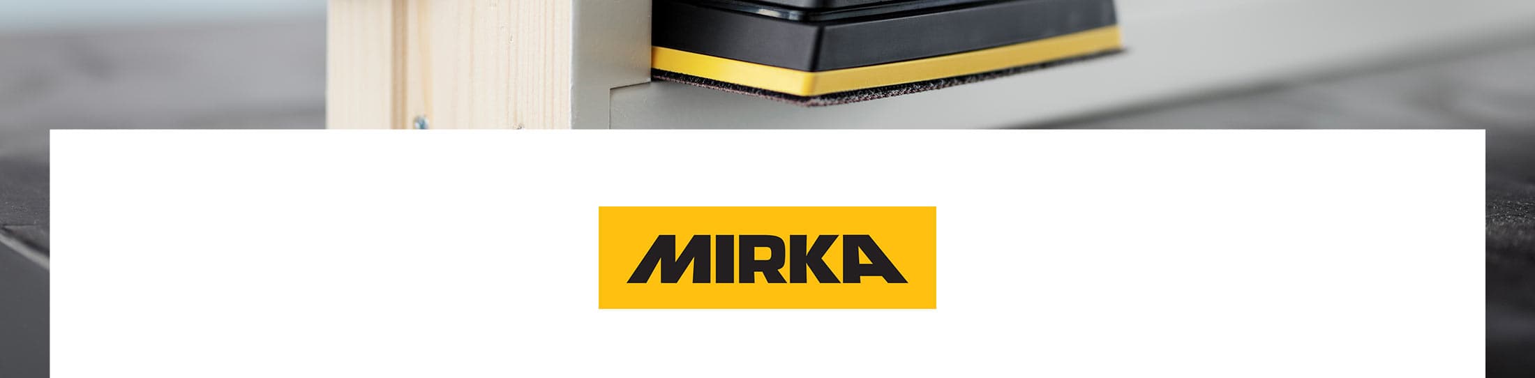A close-up of a Mirka tool with a black and yellow body, positioned above a large white banner featuring the Mirka logo.