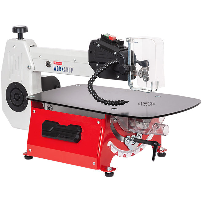 A workshop scrollsaw with a red base, black tabletop, white upper arm, and a clear protective guard, shown on a plain white background.